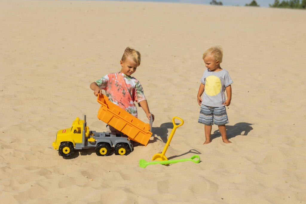 children playing on the beach safely and not needing to see our Kirkland children's emergency dentist