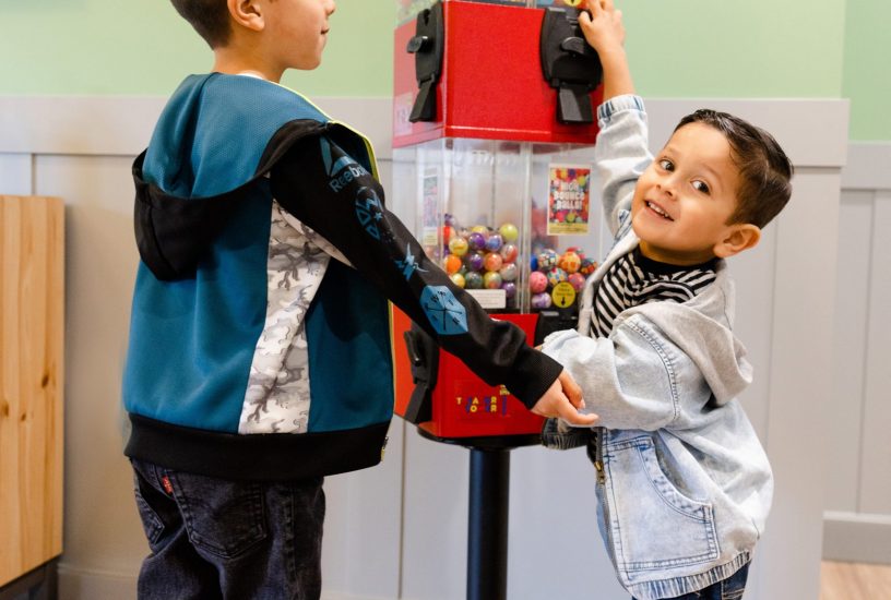 Children trying out the toy machines at Kirkland Kids Dentistry
